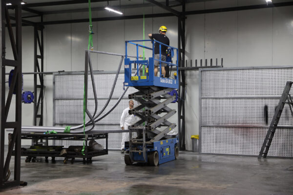 Using a scissor lift to access steel canopy