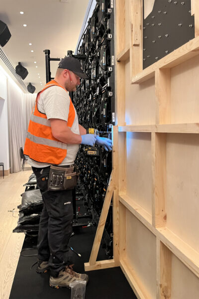 Stage One team installing timber frame for stage wall panels