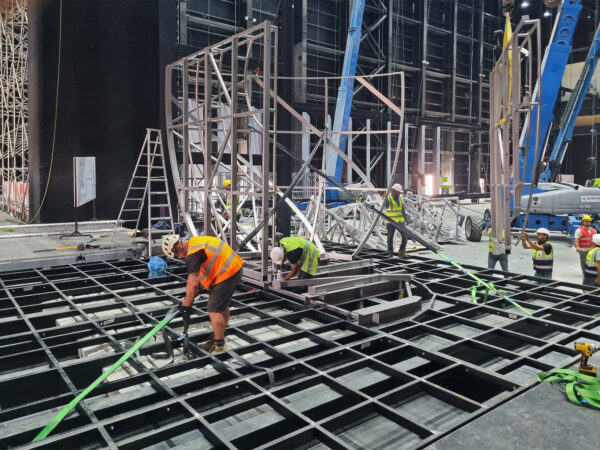 Photo of team building platform stage in arena venue