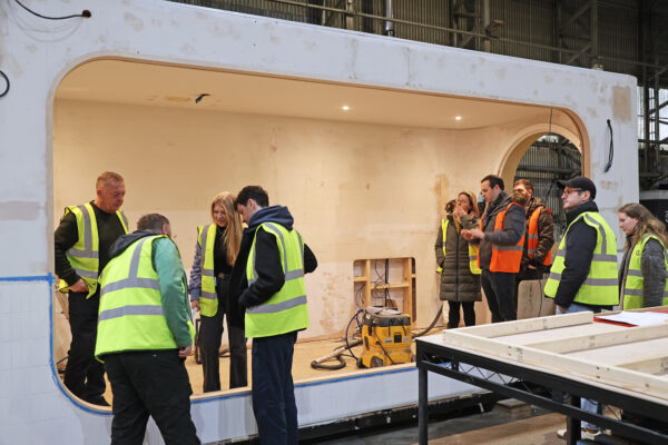 Photo of clients reviewing exhibition structures during build