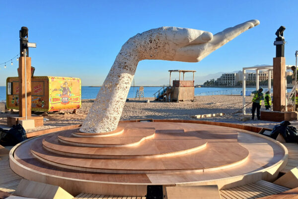 Photo of large scale hand sculpture with palm upturned