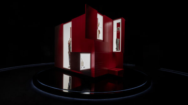 A 2.8m cubed cabinet in red finish with opening doors and drawers in a dark room