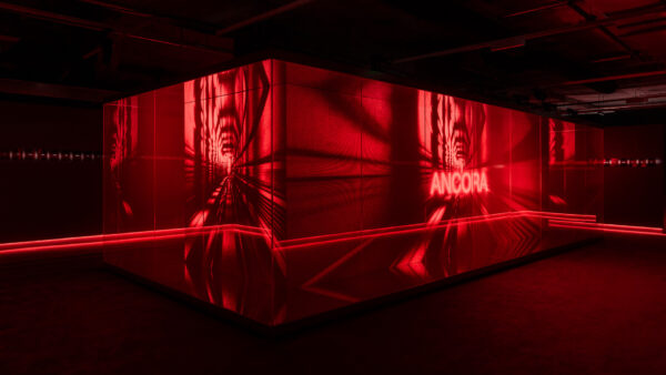 Photo of Gucci red glass box installation with image projections
