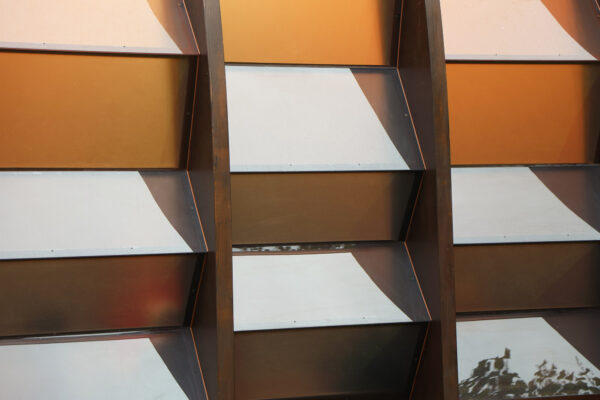 Photo of the angled polycarbonate panels of the Serpentine Pavilion 2025