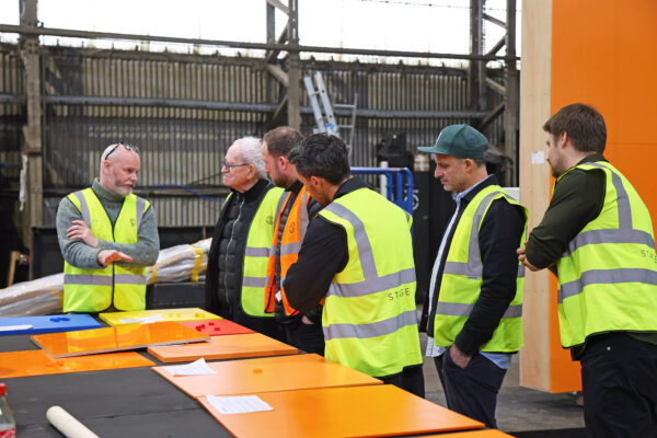 Photo of visitors at Stage One, reviewing proposed materials