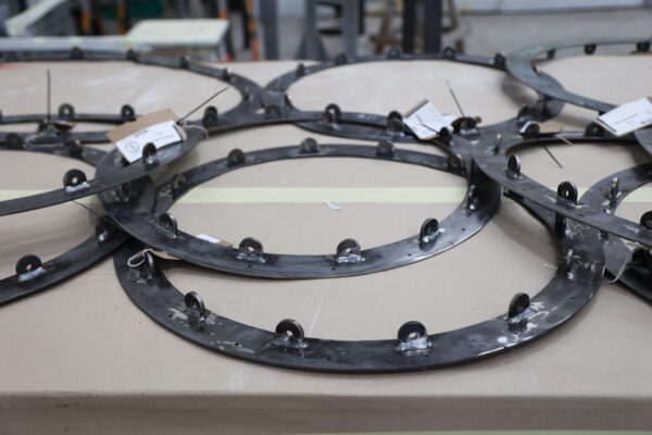 Photo of steel rings on a workbench