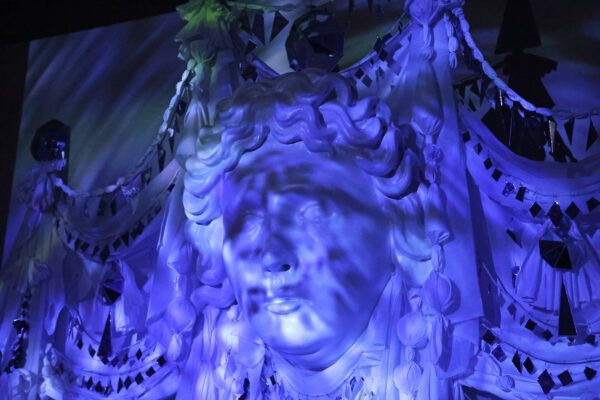 Close up of artwork installation of a large-scale sculpture of a face