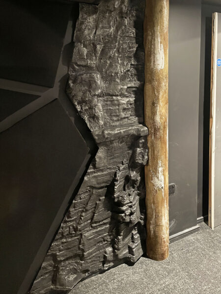 Photo of replica coal wall panel edged with a timber column