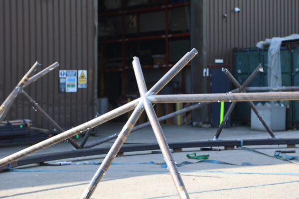 Photo of roof canopy structure being built using a network of steel CHS (circular hollow section) members and node connections
