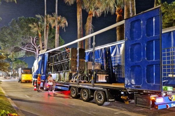 Photo of unloading a truck at night