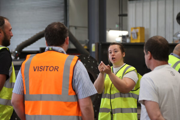 Group discussion explaining Stage One services to visitors