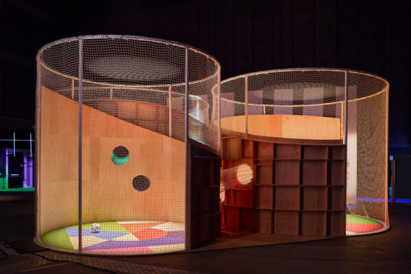 Photo of The Playmaker installation, three adjoining netted pod structures