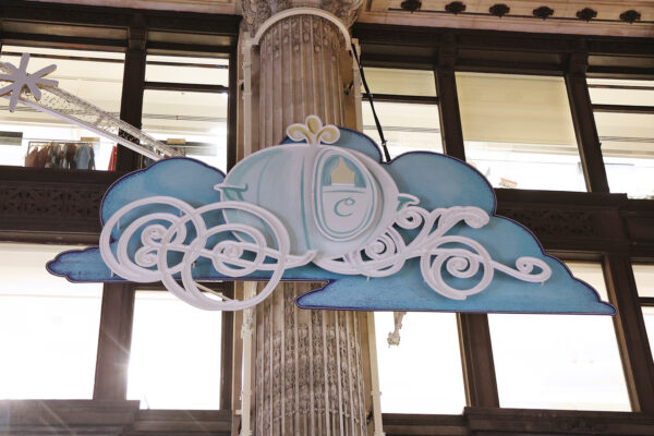 Photo of Cinderella-design facia panel installed onto a store façade