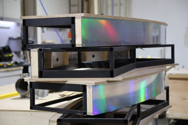 Images of stage sections, stacked metal frames topped with plywood