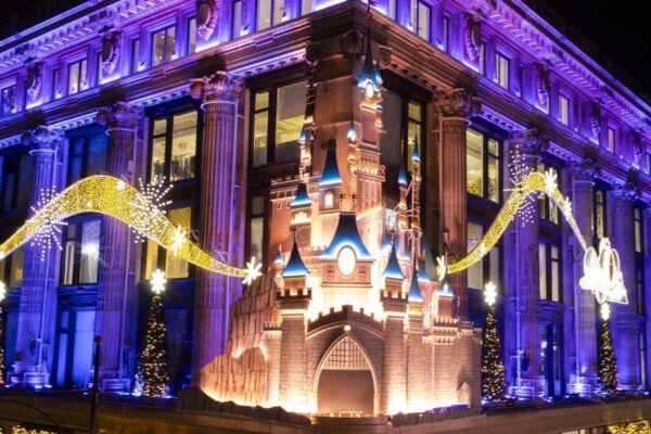 Photo of Disney themed Christmas store façade at Selfridges at night